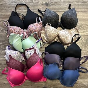 11 Victoria’s Secret bras all Size 32 DD assorted colors. All hooks are intact.